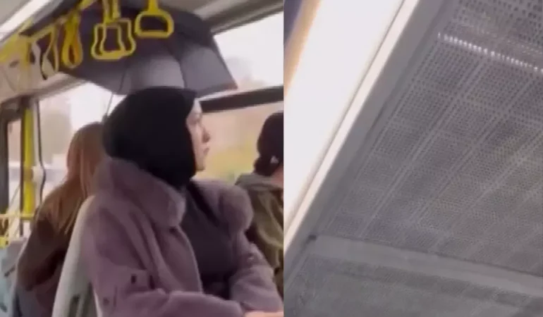 otobuste-yagmur-yagdi-yolcular-semsiye-acti-19332703_5982_amp